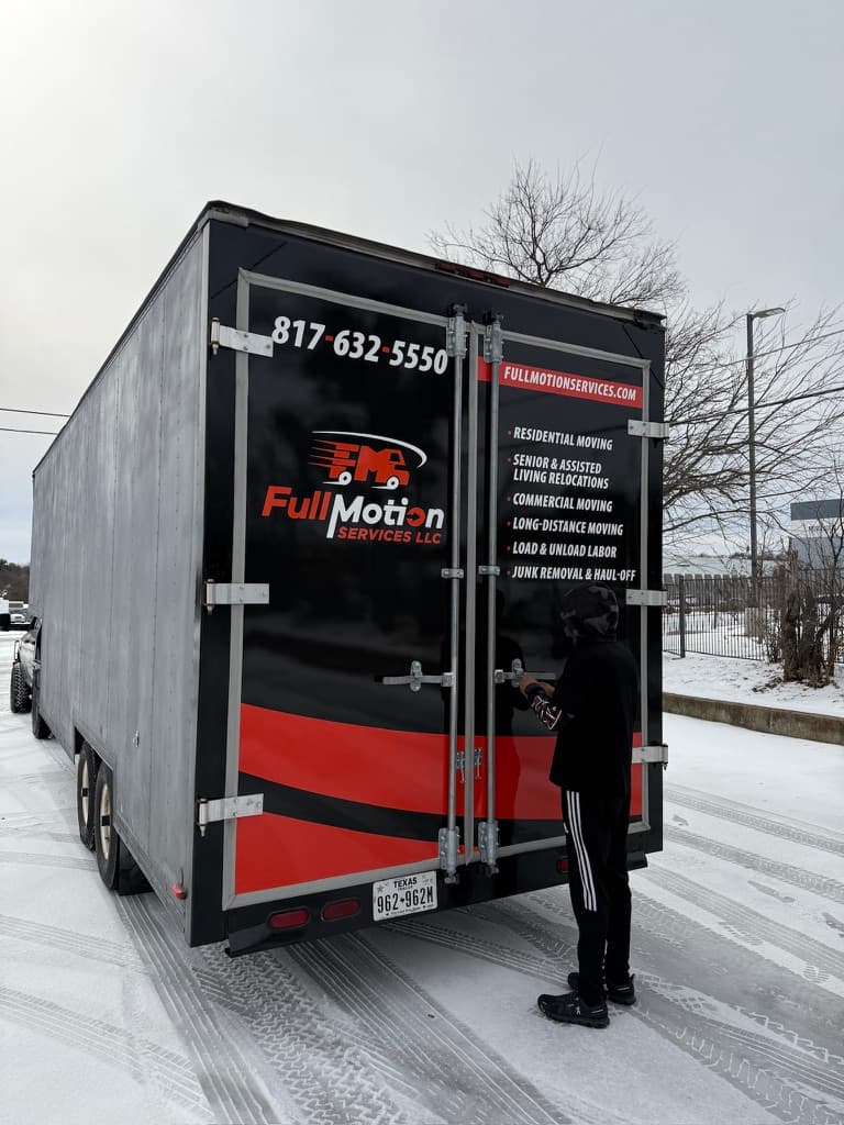Full Motion Services truck on a snowy moving day
