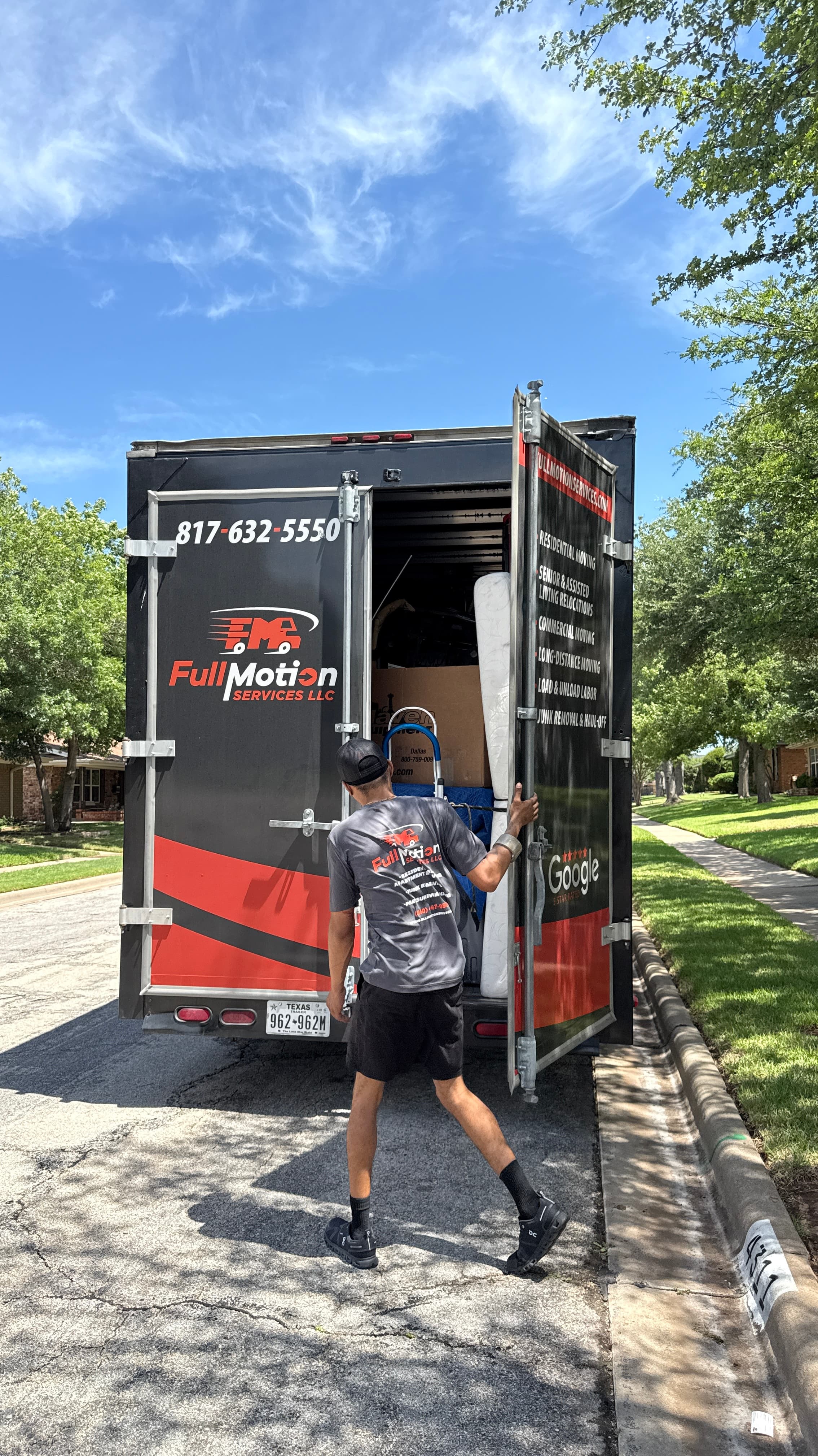 A Full Motion Services truck with a crew member unloading, showing the company's 5-star Google rating